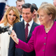 Illustration for article titled German Leader Angela Merkel Still Way Too Friendly With Robots